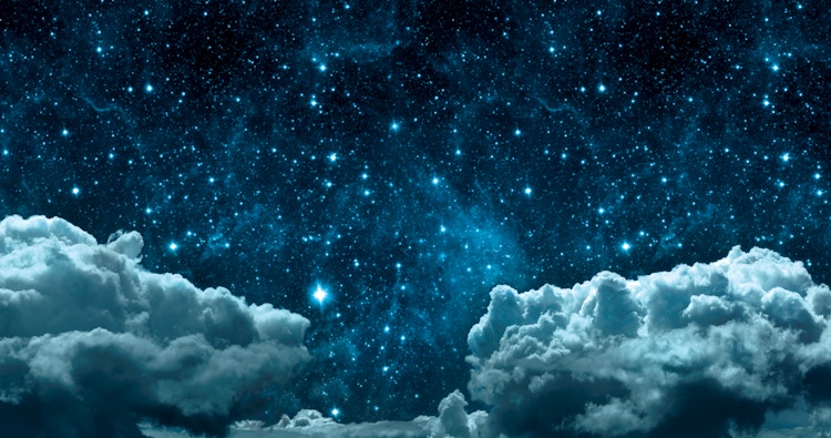 Dark blue sky with clouds and stars.