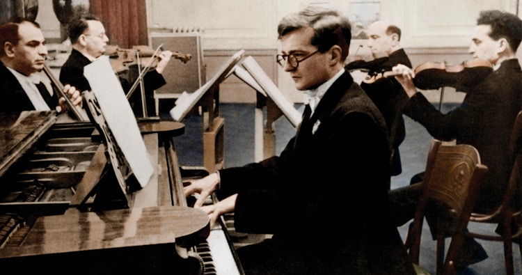 Photo of Dmitri Shostakovich by the piano.